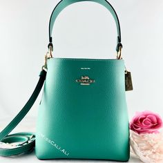 100% Authentic Brand New With Tag Sold Out In All Stores Excellent Gift - Includes Gift Bag Nwt Coach Small Town Bucket Bag In Beautiful Jade Color Soft Leather With Pink Interior. [Bag] Color: Gold/Bright Jade Double Face Leather Center Zip Compartment Snap Closure Handle With 6 3/4" Drop Detachable Strap With 22" Drop For Shoulder Or Crossbody Wear 8 1/2" (L) X 8 3/4" (H) X 4" (W) Includes:Coach Price Tag,Care Card & Gift Bag Fast Shipping Smoke-Free Home Formal Green Coach Bag, Green Formal Bucket Bag, Formal Green Coach Shoulder Bag, Green Coach Shoulder Bag For Formal Occasions, Coach Green Shoulder Bag For Formal Occasions, Coach Green Bag With Gold-tone Hardware, Elegant Green Crossbody Bucket Bag, Chic Green Coach Bag, Coach Green Shoulder Bag With Gold-tone Hardware