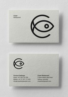 two business cards with black and white lines on them, one has an eye in the middle