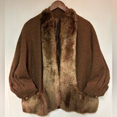 This Is An Extremely Rare 1940’s Curly Lambs Wool Coat With Beaver Fur Lapel. It’s Rare To Find A Coat In Such Good Condition. Years Ago I Worked At A High End Vintage Clothing Store And Purchased It Then. I Replaced The Missing Bakelite Bead With One That Matched As Best As I Could Find At The Time. The Coat Is Perfection. The Fur Is Perfectly In Tact - No Stains Or Snags Or Wearing Of Any Kind. It Was Kept In Storage For Its Entire Life I Think. No Moth Holes! Please Ask Me Questions If You Have Them. This Is A Really Special Piece And I Cannot Emphasize How Soft This Beaver Fur Is. I’m A True Women’s Size Medium - So Please See Images For Sizing. It Does Have A Boxy Or “Overs Retro Formal Winter Outerwear, Brown Vintage Outerwear For Fall, Brown Outerwear For Fall Vintage Fashion, Retro Fall Outerwear For Vintage Fashion, Brown Vintage Fashion Outerwear For Fall, Vintage Outerwear For Fall, Fall Vintage Outerwear, Vintage Brown Wool Outerwear, Vintage Fitted Outerwear With Shawl Collar