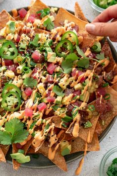 a platter filled with nachos and salsa