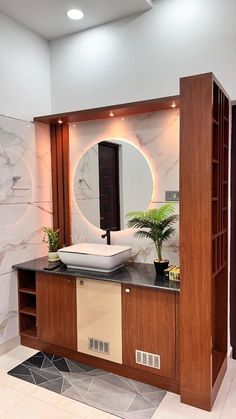 a bathroom with a sink, mirror and shelves on the wall next to each other