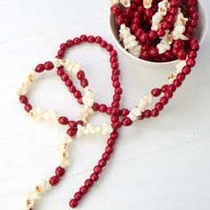 red and white beaded necklaces next to a bowl of popcorn