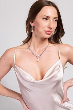 Our Bailey Glam Cubic Z Necklace Set is designed to elevate and enhance any look. The statement Necklace is detailed with an all around semi stones and rhinestone design, the adjuster allows you to wear this to your best fitting. Its the perfect everyday piece. SizeLength : 14 in.Extender : 4.5 in.Drop : 1.25 in. QualityOne Size. Adjustable fit. Oxidized Metal Coating for quality endurance. ImportedNECZ2031R Elegant Cubic Zirconia Jewel Necklaces, Elegant Pearl Jewelry For Parties, Elegant Crystal Embellished Jewelry For Gifts, Elegant Diamond Bridal Necklace With Jewels, Elegant Pearl Chain Necklace For Party, Elegant Bridal Necklace With Jewels And Cubic Zirconia, Elegant Cubic Zirconia Drop Necklace, Elegant Crystal Backdrop Necklace As Gift, Elegant Crystal Backdrop Necklace For Gift