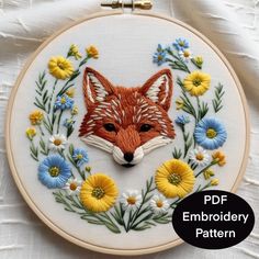 the embroidery pattern shows a fox surrounded by daisies and wildflowers, as well as text that reads pdf embroidery pattern