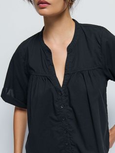 Your spring capsule called. It needs this. With a casual notch neckline, a slightly gathered seam across the bust, and boxy short sleeves, it's the blouse that's perfect for low-key coffee dates and subtle chic looks. (This one comes in Jet Black.) | Women's Filippa Blouse Top in Jet Black | Ethical Essentials Casual V-neck Top With Gathered Neckline, Effortless Short Sleeve Blouse For Casual Gatherings, Chic Short Sleeve Tops With Gathered Neckline, Casual Short Sleeve Top With Gathered Neckline, Casual Tops With Gathered Neckline And Short Sleeves, Versatile Short Sleeve Blouse For Daywear, Casual Short Sleeve Blouse With Gathered Neckline, Casual Blouse With Gathered Neckline And Short Sleeves, Casual Tops With Gathered Neckline For Daywear