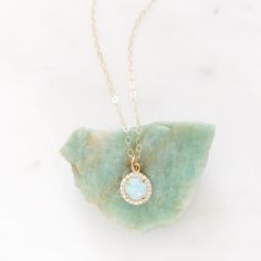 "DESCRIPTION: The MIRA Necklace - beautiful opal + cz pendant on a dainty gold filled chain. We love this look perfect for layering. MATERIALS: Chain, clasp, and jump rings - Gold filled Pendant - Opal + CZs set in gold plated PENDANT SIZE: Approximately 1/4\" in diameter PACKAGING: Your necklace will arrive on a Dainty Doe signature jewelry card placed in a white jewelry box, with a bow and tag, perfect for gift giving! GIVING A GIFT: We would love to include a hand written note for the recipie Silver Jewelry Cleaner, Gold Sunburst, Jewelry Photography Styling, Necklace Opal, White Jewelry Box, Opal Pendant Necklace, Round Rock, Dainty Gold Necklace, Cz Pendant