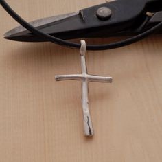 A minimalist sterling silver cross pendant necklace for men that shows his commitment to Lord while making the perfect accent for his hand-tailored suit. What makes it most unique, is that it has a primeval vibrancy that is dramatically striking. Ideal to wear every day, it looks great with everything and might just become your signature staple accessory. Give the gift of love and light with this original City Lights Jewellery creation. Order now to guarantee availability. Cross measures 4cm x 2 Modern Crucifix Cross Necklace As Gift, Minimalist Adjustable Cross Pendant Necklace, Adjustable Minimalist Cross Necklace, Modern Cross Necklace As A Gift, Minimalist Handmade Cross Jewelry, Simple Sterling Silver Cross Pendant Jewelry, Simple Sterling Silver Cross Pendant Necklace, Simple Sterling Silver Cross Pendant, Modern Sterling Silver Cross Pendant