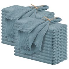 six blue towels stacked on top of each other