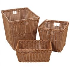 three brown wicker baskets sitting next to each other