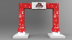 a red and white arch with snowflakes on it