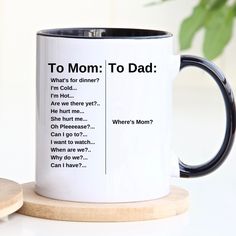 a white and black coffee mug with the words to mom to dad printed on it