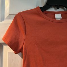 New Without Tags H&M Size Medium Thick Material Ribbed Shirt Really Nice Orange Color Somewhat Fitted Cut Pit To Pit Measures 14.5 In Length 20 In 3/$48 Add 3 “3/$48” Listings To A Bundle And I’ll Send You An Offer For $48! Orange Ribbed Crew Neck Top, Casual Orange Ribbed Top, H&m Cotton Tops For Fall, Spring Fitted Basic Shirt, Basic Fitted Shirt For Spring, Fitted Basic Shirt For Spring, Orange Ribbed Tops For Spring, Orange Ribbed Summer Tops, Fitted Orange Ribbed Top