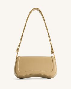 a beige handbag on a white background, with the handle extended to the side