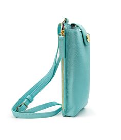 A miniature marvel of form and function, the Paris Phone Pouch holds all your necessary essentials securely in style. Made of gorgeous Italian leather in an aqua blue hue, it stores any sized phone in the main compartment, plus there’s also three credit card/ID pockets. Securing your phone in place with a top flap snap, this crossbody-style bag also has a side zipped section for keys and other must-haves. The Paris is perfect for a night out when a little bag goes a long way — just toss the adju Blue Phone Bag With Cell Phone Pocket For On-the-go, Functional Blue Phone Bag With Cell Phone Pocket, Versatile Blue Phone Bag With Removable Pouch, Blue Crossbody Phone Bag With Card Slots, Blue Leather Phone Bag With Cell Phone Pocket, Card Id, Tassel Keychain, Straw Bags, Gold Monogram