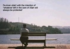 a man sitting on top of a wooden bench