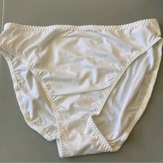 Pack Of 10 White Bikini Panties | Nwt Style: 5051 Description: Bikini Color: White Size: Large And Medium Material: 75% Antron And 25% Spandex Smoke And Pet Free Home White Stretch Bottoms For Pool, White Stretch Swimming Bottoms, White Brief Bottoms For Poolside, White Brief Swim Trunks For Beach, White Stretch Brief Swimwear, White Beach Bottoms In Brief Style, White Beach Brief Bottoms, White Brief Bottoms For Beach, White Beach Bottoms