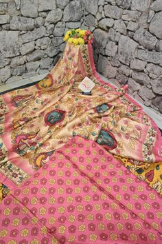 A change in your wardrobe this season is a must - and to bring on the change try out our designer ghazi silk collection with kalamkari print work on the whole body with a complementing touch of artistic kalamkari work on the pallu and the border too. Color: A shade of deep cream and pink color Technique: Amazing traditional kalamkari print work on the whole saree Fabric: Ghazi Silk Printed Silk Kurta For Festive Occasions, Transitional Designer Salwar Kameez With Kalamkari Print, Silk Kurta With Printed Motifs For Navratri, Festive Printed Silk Kurta, Designer Multicolor Silk Kurta, Bohemian Kalamkari Print Designer Kurta, Bohemian Kalamkari Print Kurta For Designer Wear, Bohemian Kalamkari Kurta For Designer Wear, Multicolor Silk Kurta For Navratri