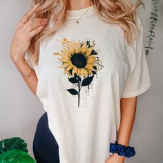 This Retro Sunflower T-shirt is a soft-washed, garment-dyed fabric that brings extra coziness to your wardrobe while the relaxed fit makes it an excellent daily choice. The double-needle stitching throughout the tee makes it highly durable while the lack of side-seams helps the shirt retain its tubular shape. .: 100% ring-spun cotton .: Medium fabric (6.1 oz/yd² (206.8 g/m .: Relaxed fit .: Sewn-in twill label Cotton Short Sleeve T-shirt With Sunflower Print, Cotton Crew Neck T-shirt With Sunflower Design, Casual White T-shirt With Sunflower Design, Casual Cotton T-shirt With Sunflower Print, Casual Tie Dye Tops With Floral Print, Cotton T-shirt With Sunflower Design, Casual Sunflower Design T-shirt With Relaxed Fit, Relaxed Fit Short Sleeve T-shirt With Sunflower Design, Relaxed Fit Cotton T-shirt With Sunflower Design