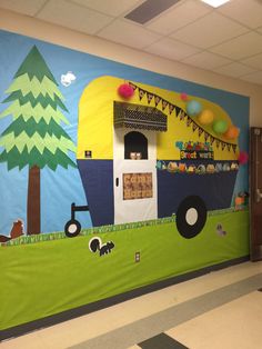 a classroom wall with a camper theme painted on it's front and back