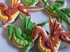 some decorated cookies are sitting on a plate