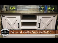 an old tv stand is painted white and has barn doors on the top, with text overlay that reads lemonade media console build