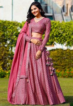 Readymade Faux Georgette Lehenga in Pink. This attire with Shantoon and Cotton Lining is Enhanced with Fancy Tassels, Side Zip, Resham and Mirror WorkAvailable with a Faux Georgette Pink Choli Crafted in V Neck and Full Sleeves and a Faux Georgette Dupatta in Pink. The Choli and Lehenga Lengths are 14 and 42 inches respectively. Do Note: Accessories shown in the image are for presentation purposes only. (Slight variation in actual color vs. image is possible). We sell all kinds of Lehenga and Ch Short Sleeve Lehenga, Lehenga Designs With Sleeves, V Neck Choli Designs, Full Length Blouse Designs For Lehenga, Women Lehanga Designs, Diwali Dress For Women, Western Chaniya Choli Designs Weddings, Lehenga For Diwali Festival, Traditional Dresses Indian Lehenga Choli