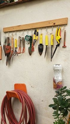 there are many different tools hanging on the wall