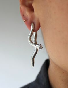 Historically, serpents represent a creative life force. Considered guardians of sacred spaces and symbols of wisdom, good fortune, rebirth, transformation, immortality, and healing. Powerful divine feminine energy. Medium weight earrings. Available in bronze or sterling silver. All earring posts are sterling silver. Silver backings will accompany the silver earrings, gold plated backings with the bronze pair. All pieces are hand carved and cast using the lost wax casting process. No two will be Symbols Of Wisdom, Divine Feminine Energy, Sacred Spaces, Tarnish Remover, Bronze Jewelry, Wax Casting, Lost Wax Casting, Life Force, Earring Posts