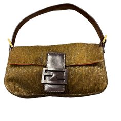 This Is An Authentic Fendi Leather Beaded Baguette Shoulder Bag In Gold. This Retro Baguette Is Crafted With Beautiful Iridescent Yellow Gold Beads And Metallic Gold Hardware. The Bag Features A Dark Brown Leather Front Strap With A Ff Logo And A Looping Leather Strap With Buckles. This Flap Opens With A Magnetic Closure To A Orange Satin Interior With A Zipper Pocket. This Is A Beautiful Bag For Your Day And Evening Essentials, With The Classic Style From Fendi! Base Length: 11.50 In Width: 2.00 In Height: 6.25 In Drop: 6.00 In Designer Brown Baguette Bag For Evening, Formal Gold Baguette Bag, Brown Baguette Evening Bag, Luxury Baguette Bag For Party, Brown Baguette Bag For Evening, Designer Baguette Bag For Party, Designer Evening Baguette Shoulder Bag, Designer Evening Baguette Bag, Orange Satin