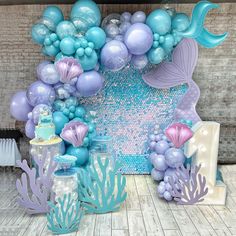 a mermaid themed birthday party with balloons and decorations