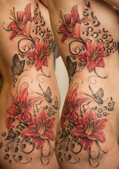 a woman's lower body with flowers and butterflies on her legs, both showing their tattoos