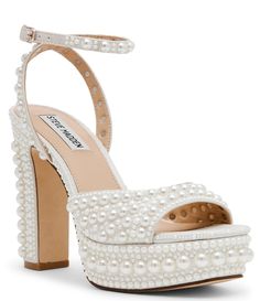 From Steve Madden&#x2C; the Assured-P Pearl Ankle Strap Platform Sandals feature:Shimmer fabric upper with faux pearl embellishmentAnkle strap with buckle closureAdjustable ankle strapLeather liningSynthetic outsoleApprox. 1.25" platform heightApprox. 4.75" heel heightImported. Hoco Heels, Pearl Heels, Unique Wedding Shoes, Wedding Shoes Platform, Elegant Texture, Pearl Shoes, Pearl Sandals, Women Platform Sandals, Steve Madden Sandals