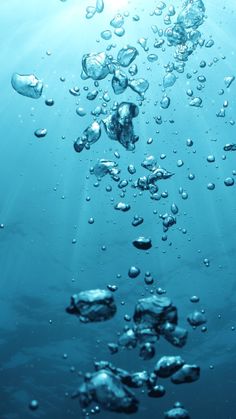 water bubbles floating in the ocean on a sunny day