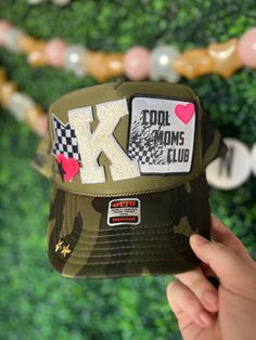 For all the Cool Moms and Camo Lovers! This hat is a whole summer vibe... Show off your style with this precious hat.  Want it on a hot pink hat? Want to switch out the chain? All our hats are totally customizable, so message us to request custom colors or patches. We can build a custom listing just for you! Fun Summer Snapback Dad Hat, Spring Trucker Hat For Vacation, Fun Summer Dad Cap, Fun Summer Dad Hat, Trendy Trucker Hat Visor For Vacation, Beach Trucker Snapback Hat With Short Brim, Fun Snapback Hat With Short Brim For Beach, Summer Visor Trucker Hat, Trendy Summer Visor Dad Hat