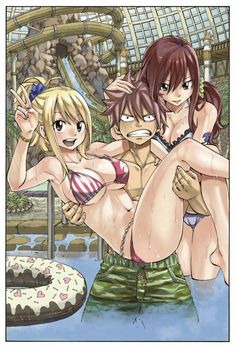 an image of two women in bikinis and one man with no shirt standing next to a cake