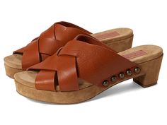 a pair of women's brown sandals with wooden soles and straps on the bottom