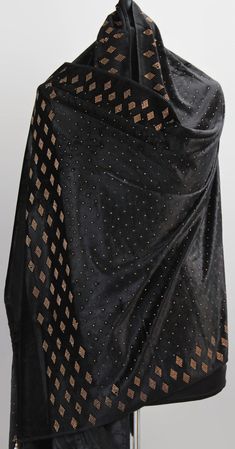 Introducing Fully embroidered Pakistani/Indian velvet Bridal shawl. Exclusive Velvet Stole is so soft and very light to carry any where with you. Its fibers range from 16-18 microns.  Black Velvet with Gold and Sequin Thread Embroidery. The bright and bold colors of the embroidery make this Shawl a perfect accessory to brighten up any outfit. It can be worn draped over the shoulders or wrapped around the head, adding a touch of elegance and sophistication to any traditional or contemporary attire. You've always loved the romantic thrill of looking for something authentic. Something with an antique theme. Brand new beautiful Velvet Stole gift for you and for your loved ones. Beautiful traditional design with perfect embellishments. Easy to wear with anything and perfect for all seasons and Bridal Shawl, Thread Embroidery, Shawls And Wraps, Traditional Design, Black Velvet, Scarf Accessory, Shawl, Velvet, Brand New