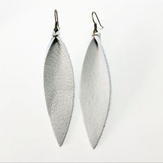 Handmade Lightweight Leather Earrings Are Made With Either Nickel Free Gold, Bronze, Silver, Gunmetal Or Rose Gold Posts. Light Gray Leather Pinched Feathers. Bronze Tone Posts Drop Length: 4.5" *Patterns, Variations, Cut And Textures May Vary But Images Are Mostly True To Color. Do Not Bathe Or Swim With Jewelry, As Materials Are Not Waterproof. Prices Are Firm Unless Bundled With Other Jeweled Art Boutique Items Handmade White Leather Jewelry, Elegant Handmade Earrings For Everyday Use, Handmade White Leather Earrings, Elegant Everyday Nickel-free Earrings, Elegant Nickel-free Earrings For Everyday Use, White Leather Earrings As A Gift, White Leather Earrings For Gift, White Leather Earrings Gift, Silver Leather Dangle Earrings