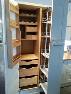 an open closet with drawers and shelves in it