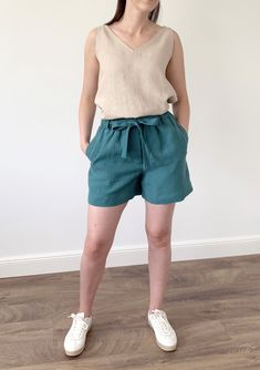 Handmade washed linen loose shorts with pockets and elastic waist. Made with love for You. *100% local medium weight linen *Washed linen *Elastic waist *Each item is individually cut and sewn by order *The model is wearing size M, shorts color - Viridian blue *Note that colors may look different on your display depending on their settings and technical characteristics. Please let us know if you need different measurements or colors. CARE: *Machine wash up to 40 / 104F gentle cycle *Iron inside o Casual Linen Shorts With Tie Waist, Green Linen Shorts With Pockets, Green Linen Beach Shorts, Green Linen Summer Shorts, Wrap Dresses Summer, Simple Midi Dress, Linen Loose Dress, Shorts With Belt, Ladies Shorts