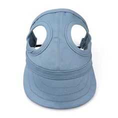 a light blue hat with holes on the front and side of it, sitting against a white background