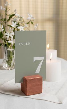 a table number sitting on top of a wooden block