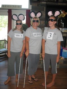 three women wearing bunny ears and t - shirts