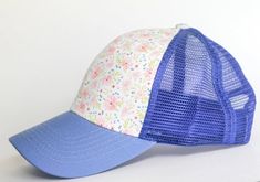 Pretty, fun, and comfortable hat for girls and moms! This sweet floral pattern makes this trucker hat perfect for the ladies and kids that love to wear a trucker hat, but don't want words, logos, or characters on their hats!Size is 21 3/4 in, 54 cm, size 6 3/4. Fits toddlers to small adult. Playful Snapback Trucker Hat For Spring, Playful Spring Trucker Hat With Curved Brim, Playful Spring Baseball Cap, One Size Fits Most, Playful Blue Trucker Hat, One Size Fits Most, Playful One Size Fits Most Baseball Cap For Spring, Blue Trucker Hat With Curved Bill For Spring, Blue Curved Bill Trucker Hat For Spring, Blue Fun Trucker Hat For Spring, Playful Spring Baseball Cap