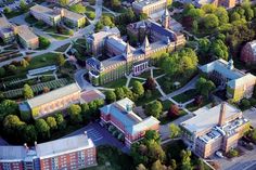 an aerial view of a campus with many buildings and trees in the area around it