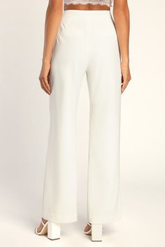 Have all the confidence you need with the Lulus A Power Mood White High-Waisted Wide-Leg Trouser Pants! Lightweight crepe woven fabric shapes a boss-babe, high banded waist with a hidden zip fly and a covered button closure. Wide pant legs fall to ankle-grazing hems and feature decorative welt pockets at the back. Pair with the matching blazer for a complete look! Fit: This garment fits true to size. Length: Floor length. Size medium Inseam: 31.25 Front Rise: 11.50 Waist: Fitted - very fitted at Elegant Elastane Wide Leg Pants, White Elastane Pants For Formal Occasions, White Formal Elastane Pants, Elegant Elastane Trousers, White High Waist Wide Leg Evening Pants, White High Waist Wide Leg Pants For Evening, White Bottoms With Elastic Waistband For Work, White Elastic Waistband Bottoms For Work, Tailored White Bottoms For Party