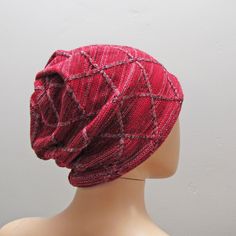 This is a fun funky Beanie Hat made with a beautiful geometric textured sweater knit .   It is made to fit loosely on your head and slouch in the back. The fabric is stretchy knit and has a very soft snug feel to it. Great for any outdoor venture. It is a one size fits most. Red Adjustable Casual Beanie, Red Beanie Hat, One Size Fits Most, Red Knitted Hat, One Size, Playful Red Beanie Hat, Slouchy Beanie Hat, Red Hand-knitted Beanie Cap, Brown Texture, Textured Sweater, Slouchy Beanie