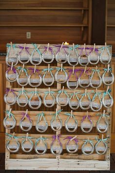 a wooden crate filled with lots of glass jars