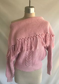 "1980's chunky pink cotton knit shawl collar pullover sweater featuring long sleeves, fringe trim and a fun cable pattern at center front. Shawl collar, hem and cuffs are a rib knit.  Sweater is clean and in great condition! There's just a couple pulls here and there. Label: Fino International - Size L - 55% Ramie, 45% Cotton - Made in China Measurements: would best fit a modern size M Bust= 42\" Bottom opening= 26\" relaxed  Shoulder width= 19\" Sleeve length= 18 1/2\" Bicep= 16 1/2\" Sleeve op Oversized Pink Knitted Sweater, Pink Knitted Long Sleeve Top, Pink Long Sleeve Knitted Top, Pink Cable Knit Long Sleeve Top, Pink Long Sleeve Cable Knit Sweater, Pink Long Sleeve Chunky Knit Top, Pink Chunky Knit Long Sleeve Top, Fall Chunky Knit Pink Top, Pink Chunky Knit Top For Fall