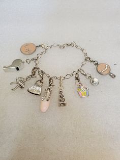 This listing is for an Artisan made Girl's charm bracelet with 9 charms. Each of the charms have a spring ring for easy remove ability. Some charms are silver while others are pink enamel. Please look at the photos and video as I provide so you can see how cute they are. Most of the charms came from Michaels while others came from the Gem Show. You can remove some charms and create your own look and style. All items are new and were hand assembled. The bracelet will arrive in gift box with FREE Studded Purse, Purse Pink, Art Deco Bracelet, Gem Show, Charms Bracelet, Charm Necklace Silver, Charm Necklaces, Silver Charm Bracelet, Pink Enamel